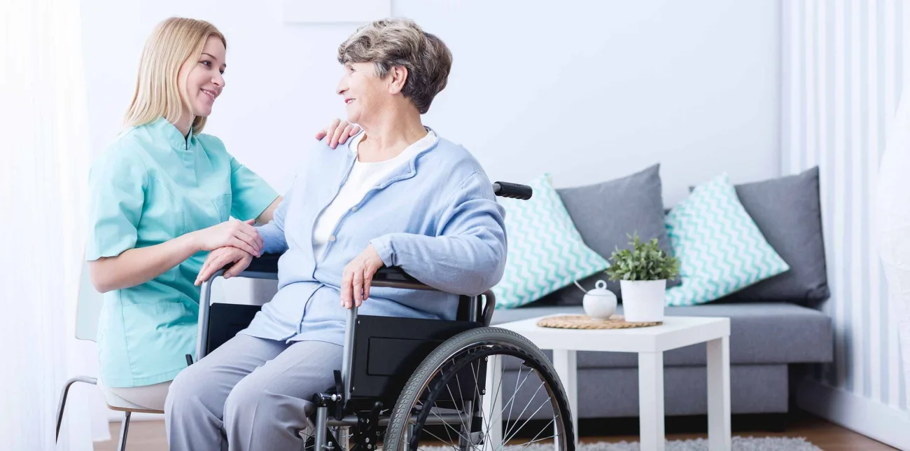 A caregiver assisting a senior client at home