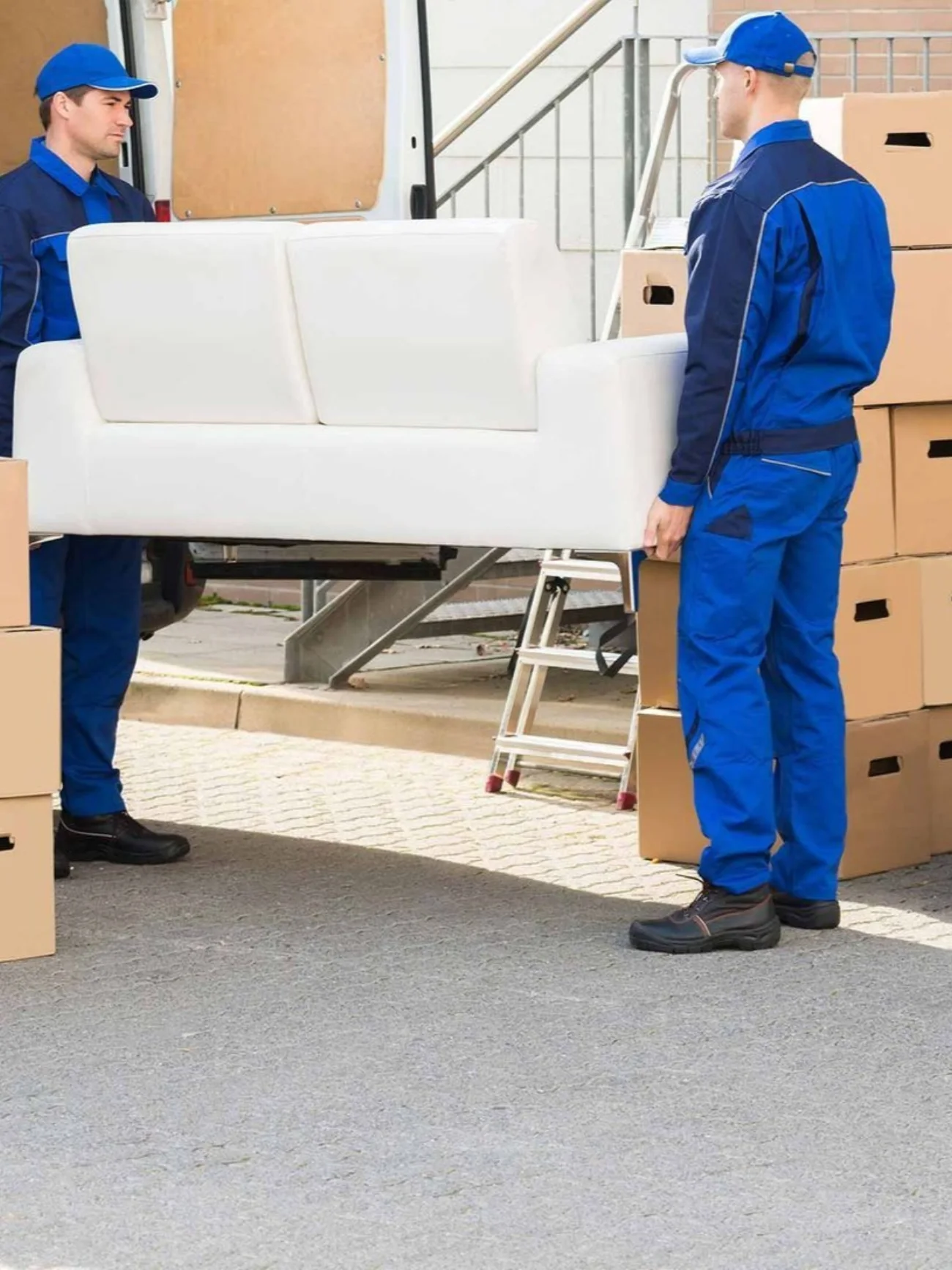 A professional moving crew carrying furniture