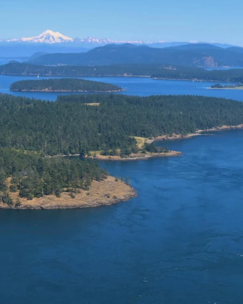 Aerial view of the San Juan Islands with Mount Baker in the distance